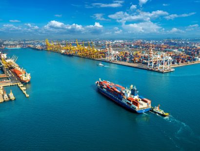 Aerial view of cargo ship and cargo container in harbor. Aerial view of cargo ship and cargo container in harbor.