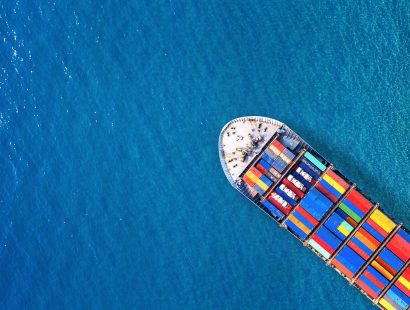 Aerial view of container cargo ship in sea. Aerial view of container cargo ship in sea.